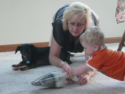 Showing my Aunt Deidre the proper way to vaccum. 