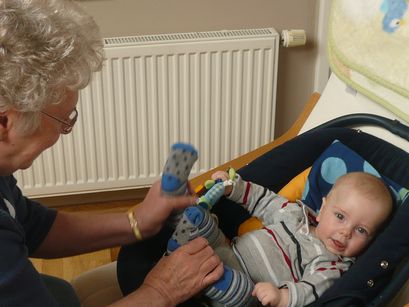 Playing footsies with Grandma. 