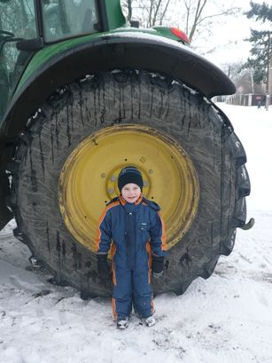 Huge wheel vs. small boy.