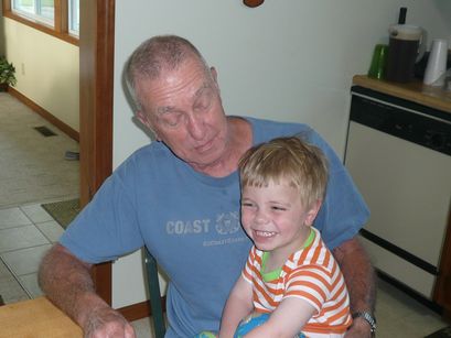 Adam having fun with Papaw. 